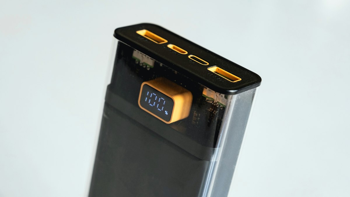 A portable power bank charging a phone