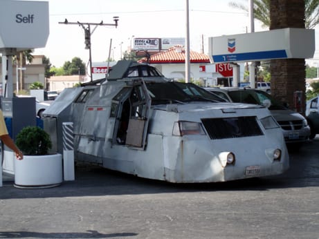 The TIV 1 armored tornado intercept vehicle parked at a gas station in 2006, with its roof camera turret and no anchoring claws
